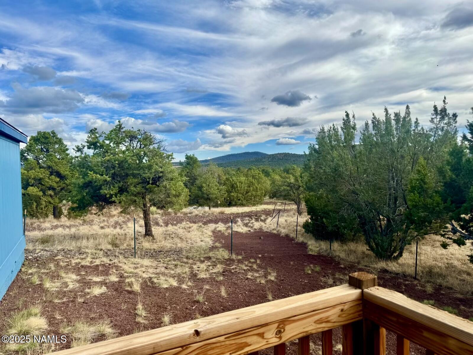 6083 North Joshua Tree Road Williams, AZ 86046 - Photo 32 of 40 a view of a yard with an outdoor space