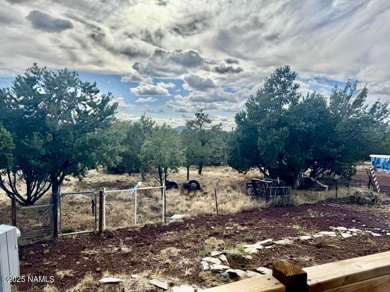 6083 North Joshua Tree Road Williams, AZ 86046 - Photo 34 of 40 a view of backyard with sitting area
