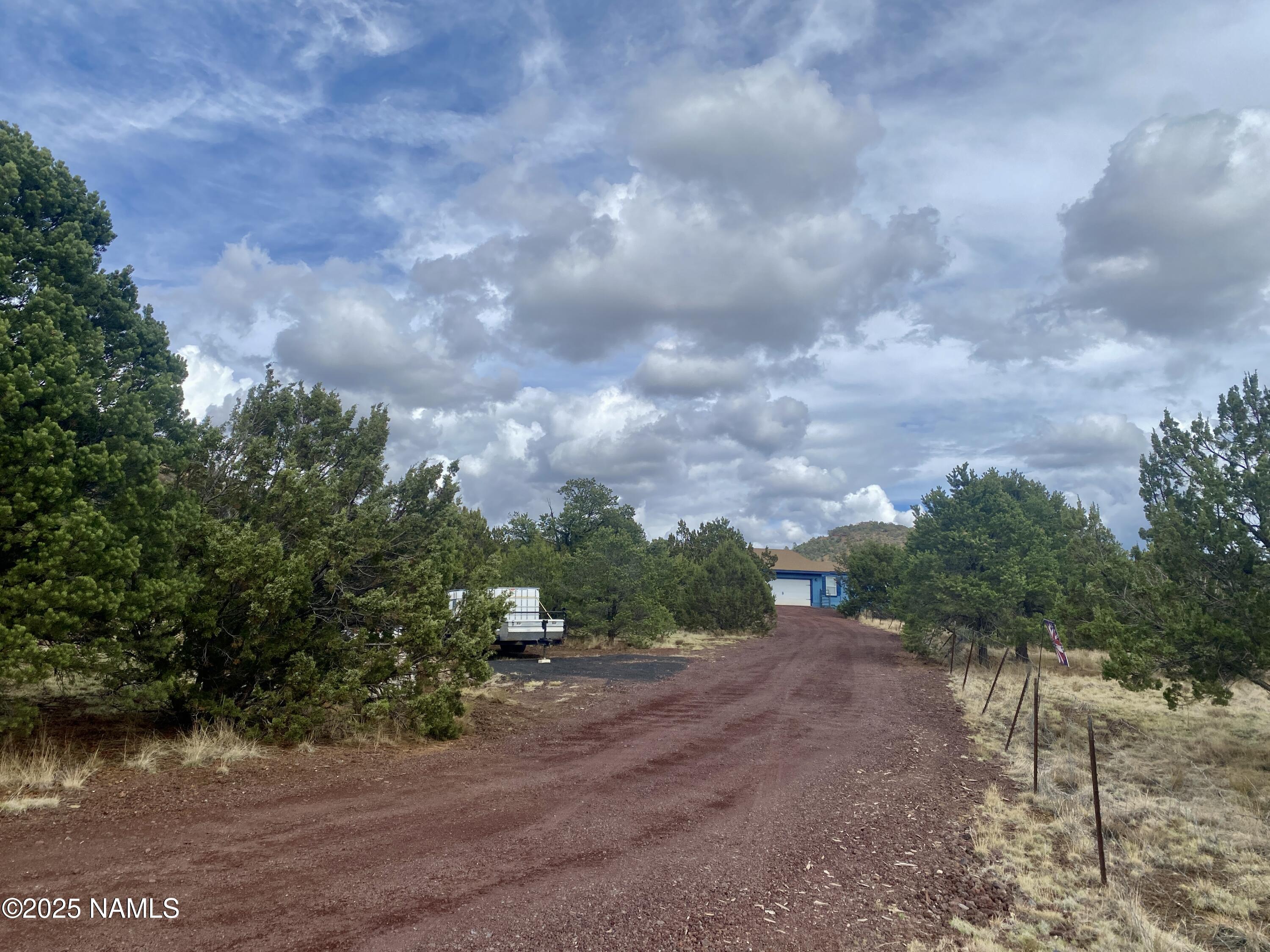 6083 North Joshua Tree Road Williams, AZ 86046 - Photo 40 of 40 a view of a street with trees in the background