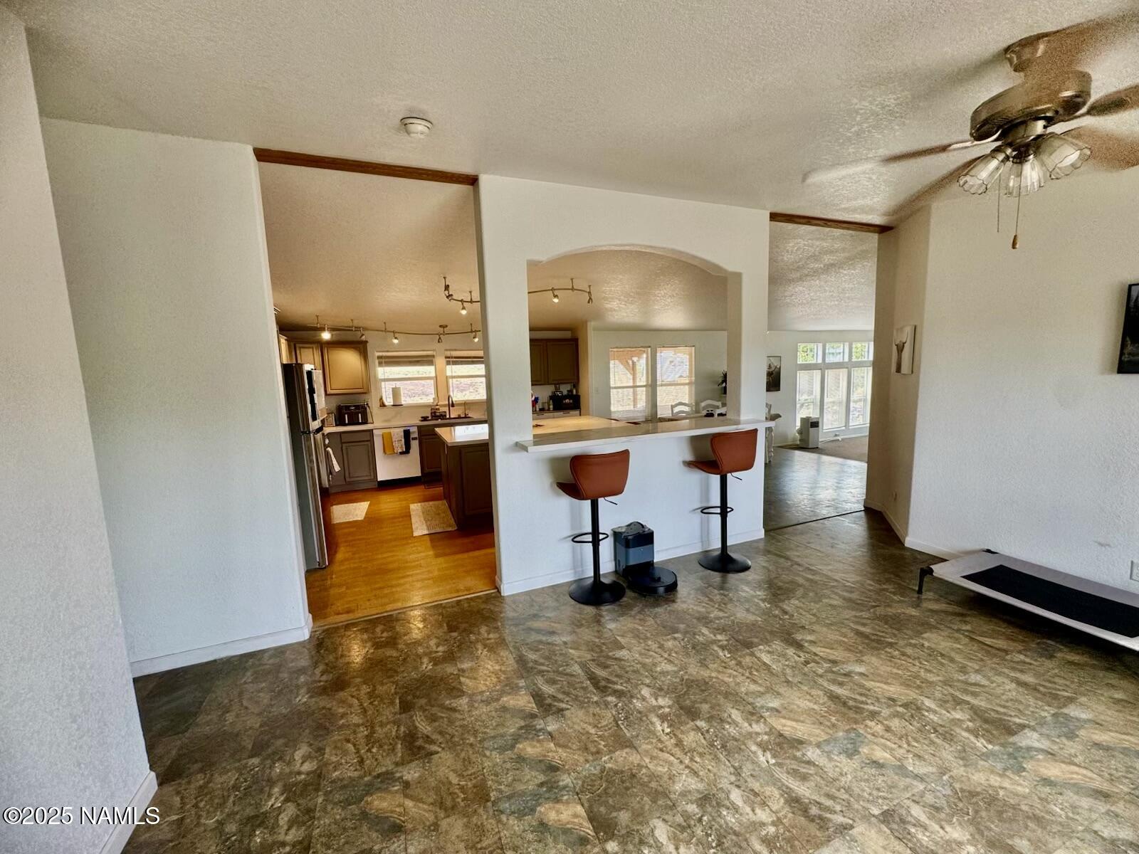 6083 North Joshua Tree Road Williams, AZ 86046 - Photo 7 of 40 a view of a workspace with furniture and a window