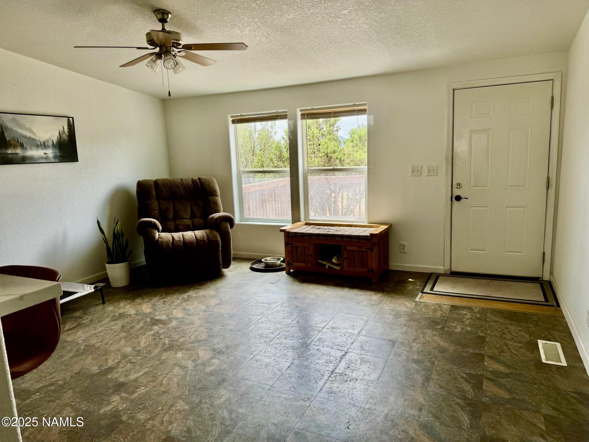 6083 North Joshua Tree Road Williams, AZ 86046 - Photo 10 of 40 a room with furniture and a window
