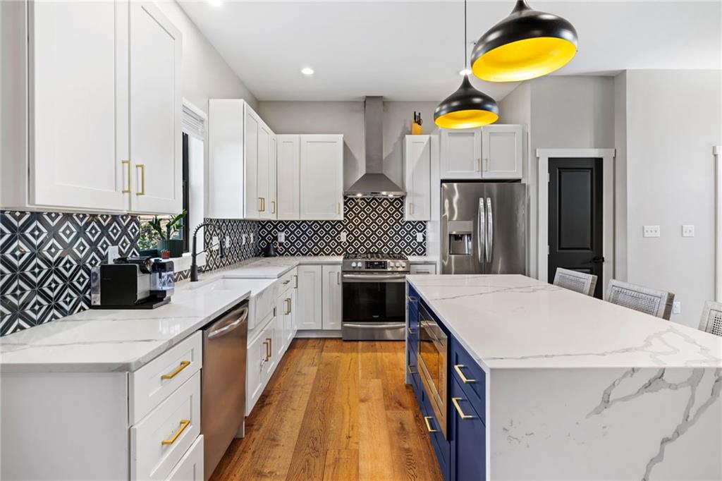734 Middle Street Pittsburgh, PA 15212 - Photo 12 of 46 a kitchen with stainless steel appliances kitchen island granite countertop a sink and cabinets