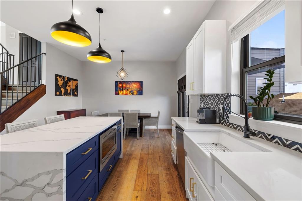 734 Middle Street Pittsburgh, PA 15212 - Photo 16 of 46 a bathroom with a granite countertop sink and a mirror