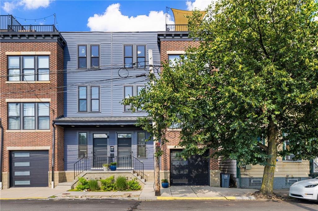 734 Middle Street Pittsburgh, PA 15212 - Photo 2 of 46 a front view of a building with street view