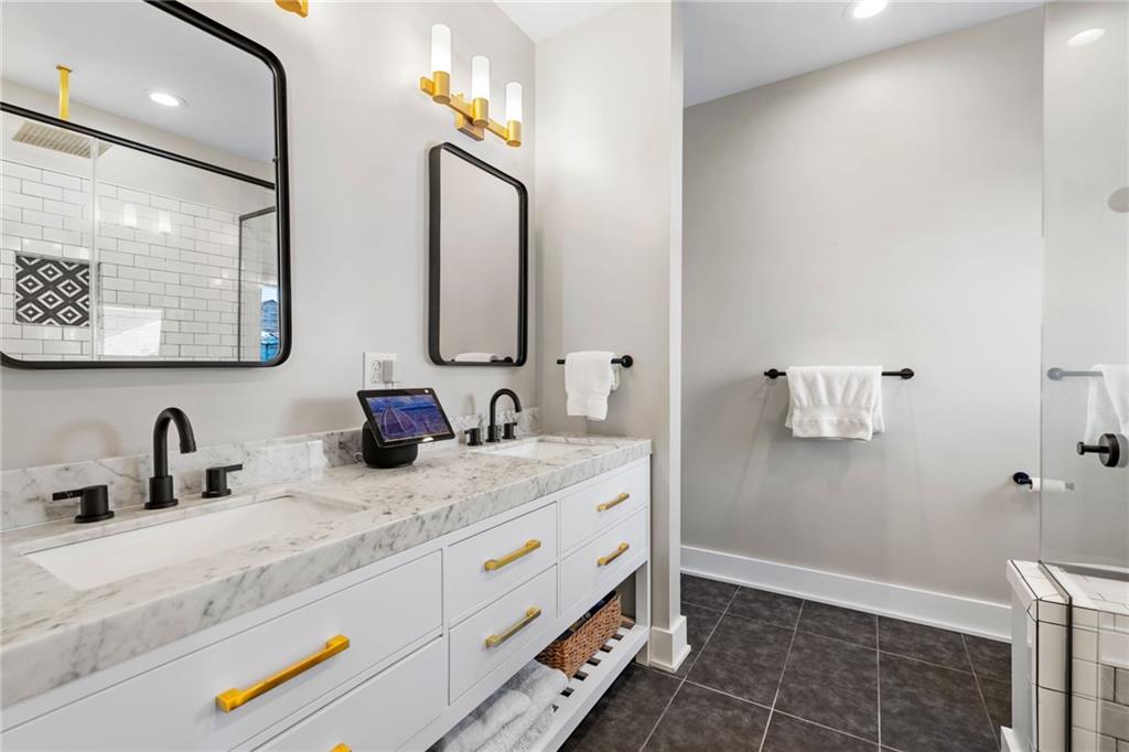 734 Middle Street Pittsburgh, PA 15212 - Photo 30 of 46 a bathroom with double vanity and a mirror