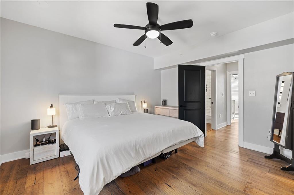 734 Middle Street Pittsburgh, PA 15212 - Photo 32 of 46 a bedroom with a bed and wooden floor