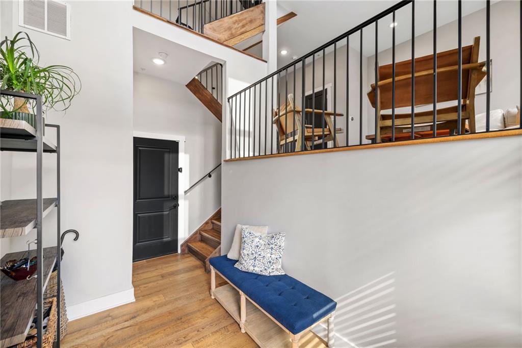 734 Middle Street Pittsburgh, PA 15212 - Photo 4 of 46 a view of staircase with wooden floor and a potted plant