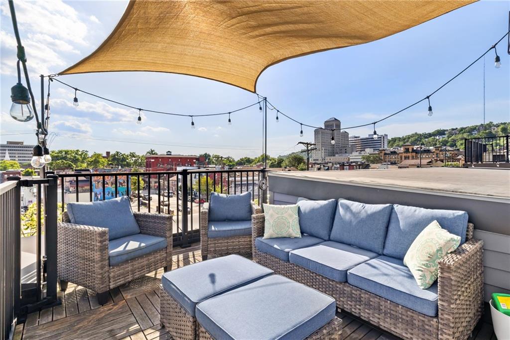 734 Middle Street Pittsburgh, PA 15212 - Photo 42 of 46 a roof deck with a table and chairs