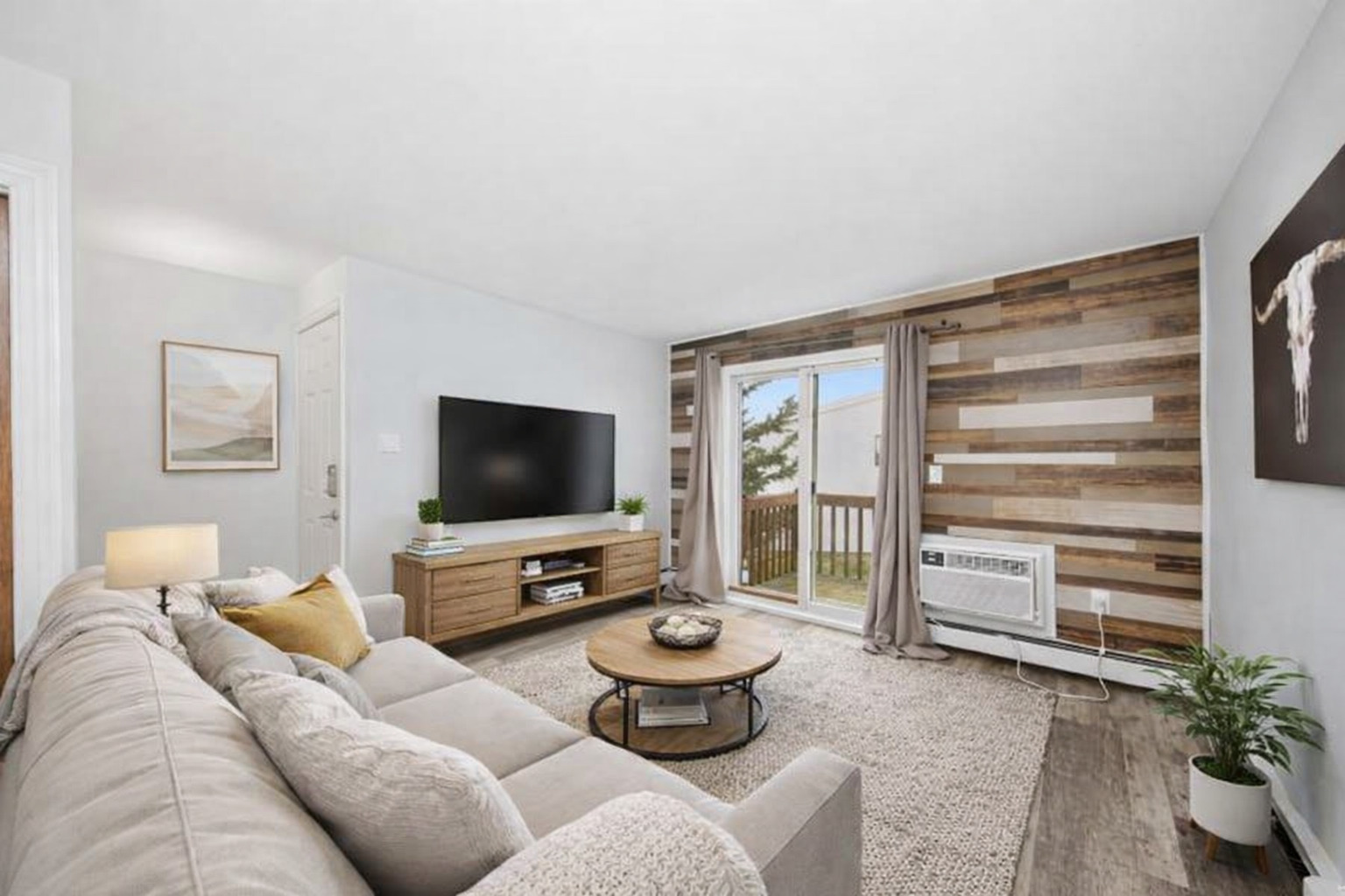 2300 Light Road, Unit 209 Oswego, IL 60543 - Photo 3 of 11 a living room with furniture and a flat screen tv