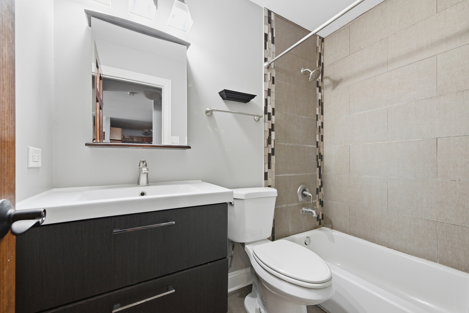 2300 Light Road, Unit 209 Oswego, IL 60543 - Photo 10 of 11 a bathroom with a sink toilet vanity and shower