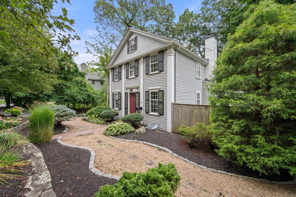 44 Hundreds Road Wellesley, MA 02481 - Photo 3 of 42 a front view of a house with garden