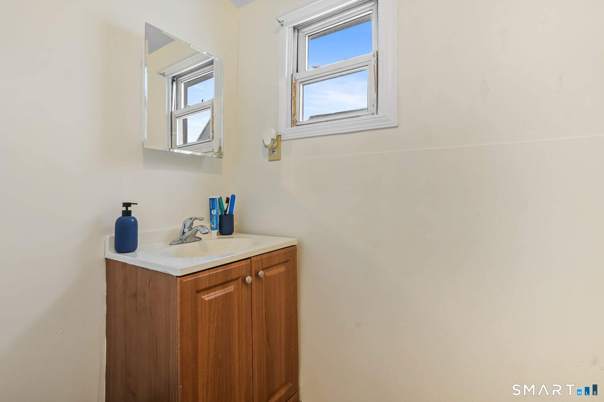36 Maltby Place New Haven, CT 06513 - Photo 20 of 38 a utility room with a sink a vanity and mirror