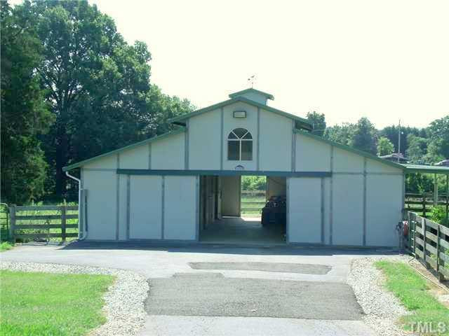 604 Mason Road Durham, NC 27712 - Photo 20 of 25 4 stall barn with tack and equipment room. Storage on the side. Fenced pastures. Stable/Barn