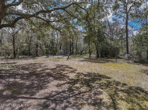 a backyard of a house with trees