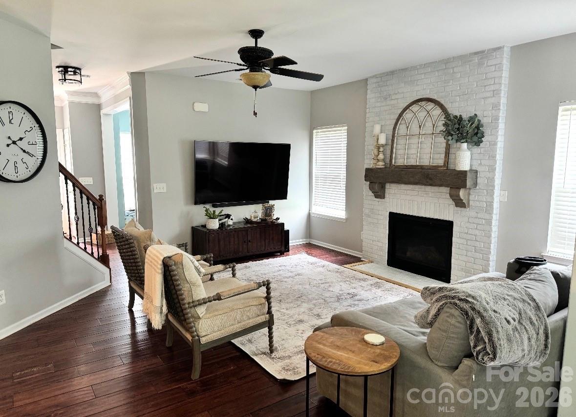 748 Beille Lane Fort Mill, SC 29708 - Photo 2 of 2 a living room with furniture a flat screen tv and a fireplace