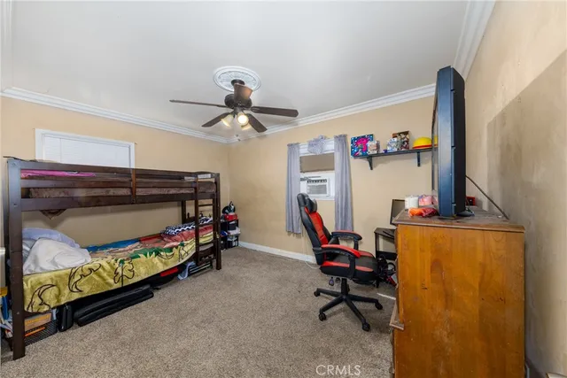 a bed room with a bed and a chandelier
