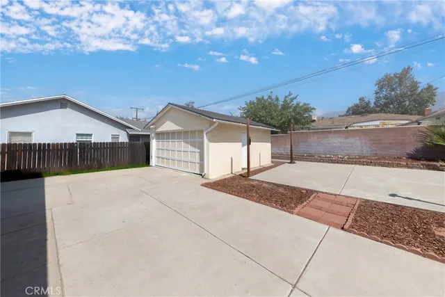 a view of house with outdoor space and view of house
