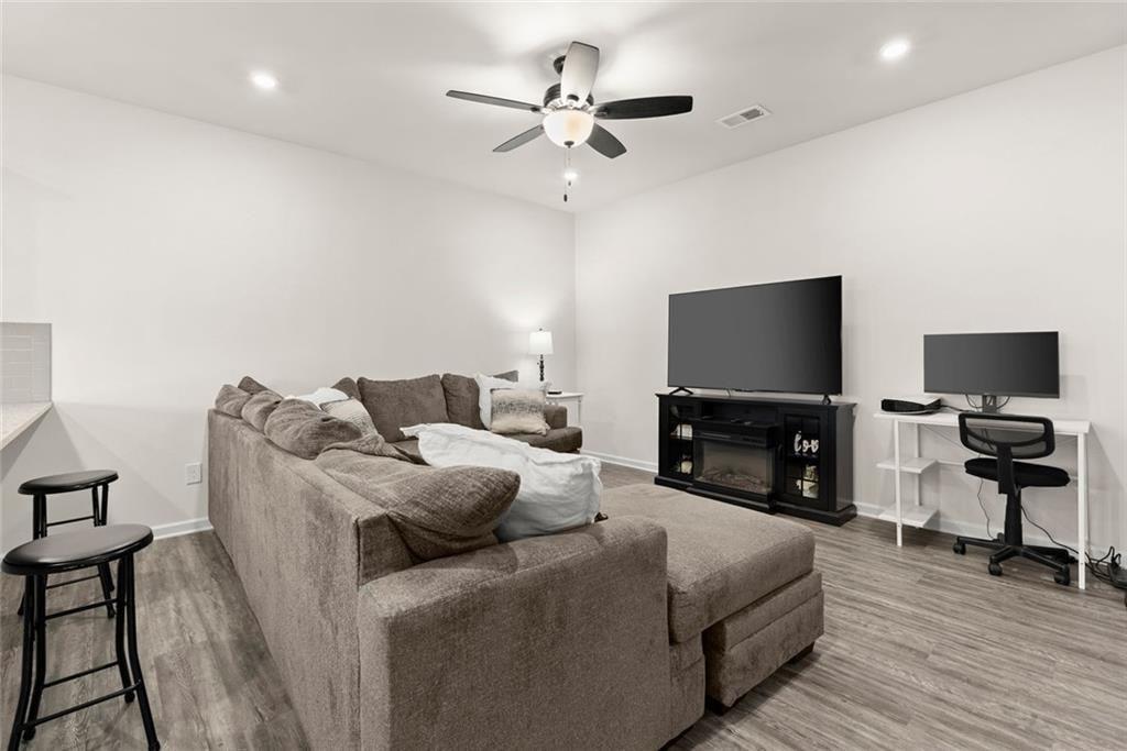 254 Pinnacle Way Jasper, GA 30143 - Photo 3 of 33 a living room with furniture and a flat screen tv