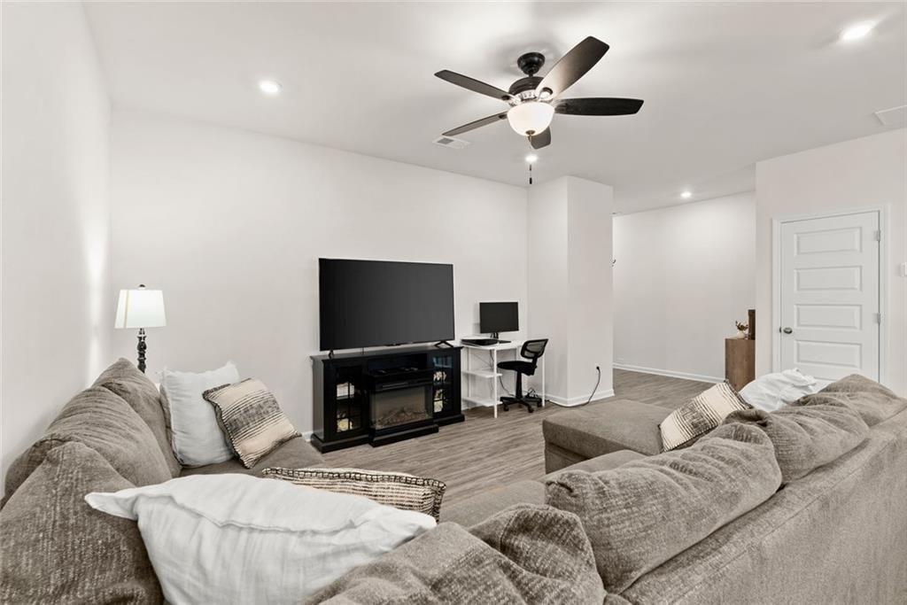 254 Pinnacle Way Jasper, GA 30143 - Photo 4 of 33 a living room with furniture and a flat screen tv with wooden floor