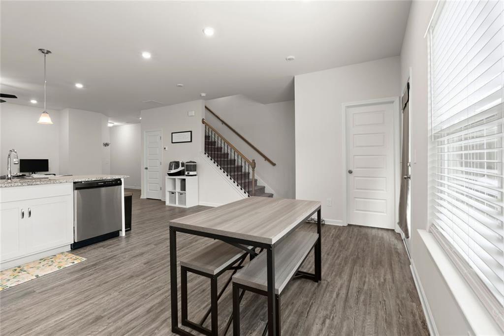 254 Pinnacle Way Jasper, GA 30143 - Photo 8 of 33 a open kitchen with a table and chairs in it