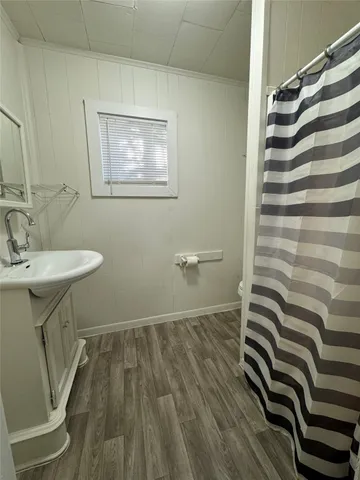 a bathroom with a sink a mirror and a toilet