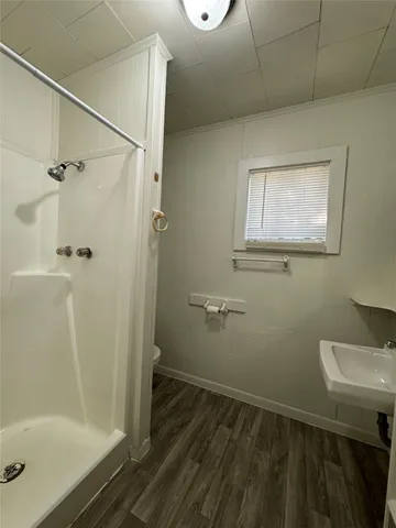 a bathroom with a sink and shower