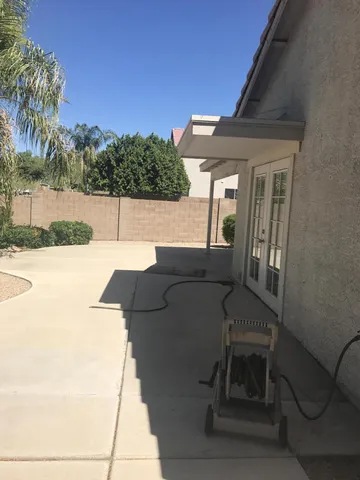 a terrace of a house with outdoor seating