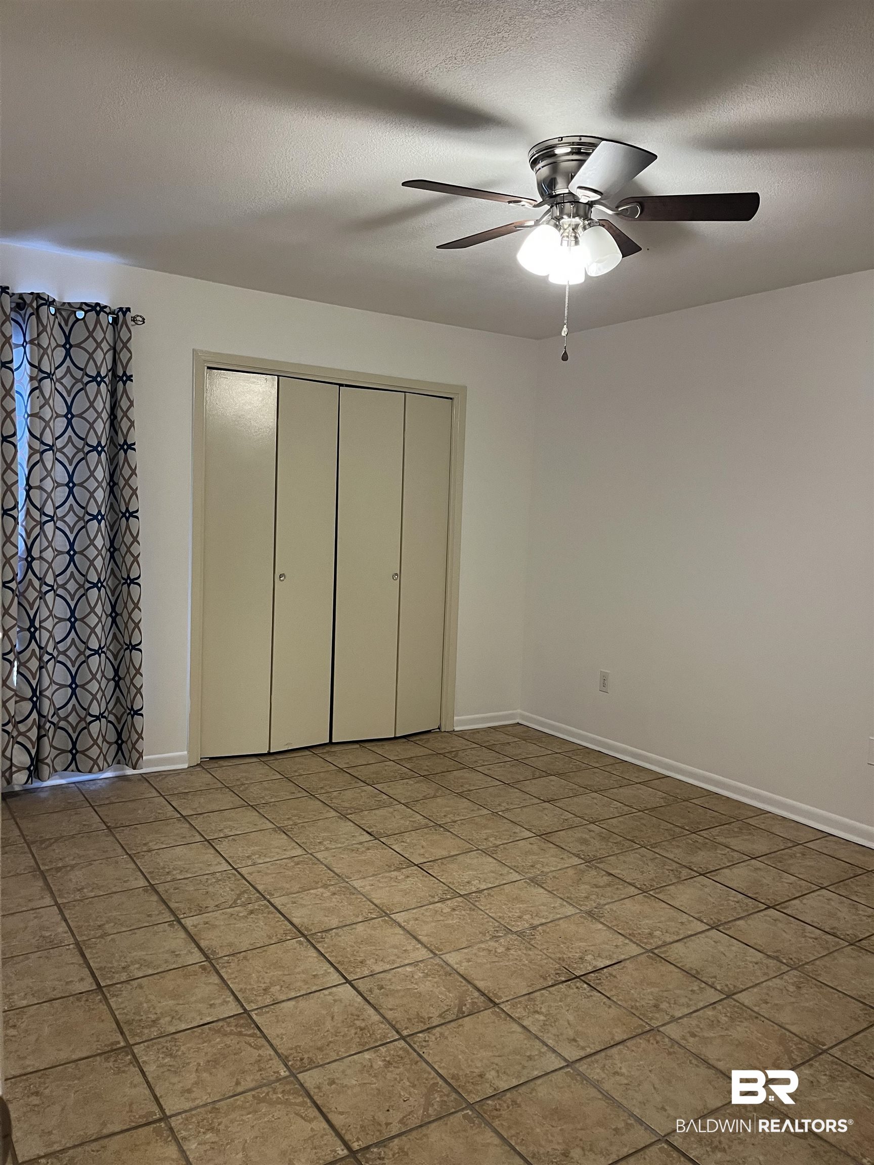 1146 North Alston Street Foley, AL 36535 - Photo 18 of 20 Unfurnished bedroom with a closet and a ceiling fan