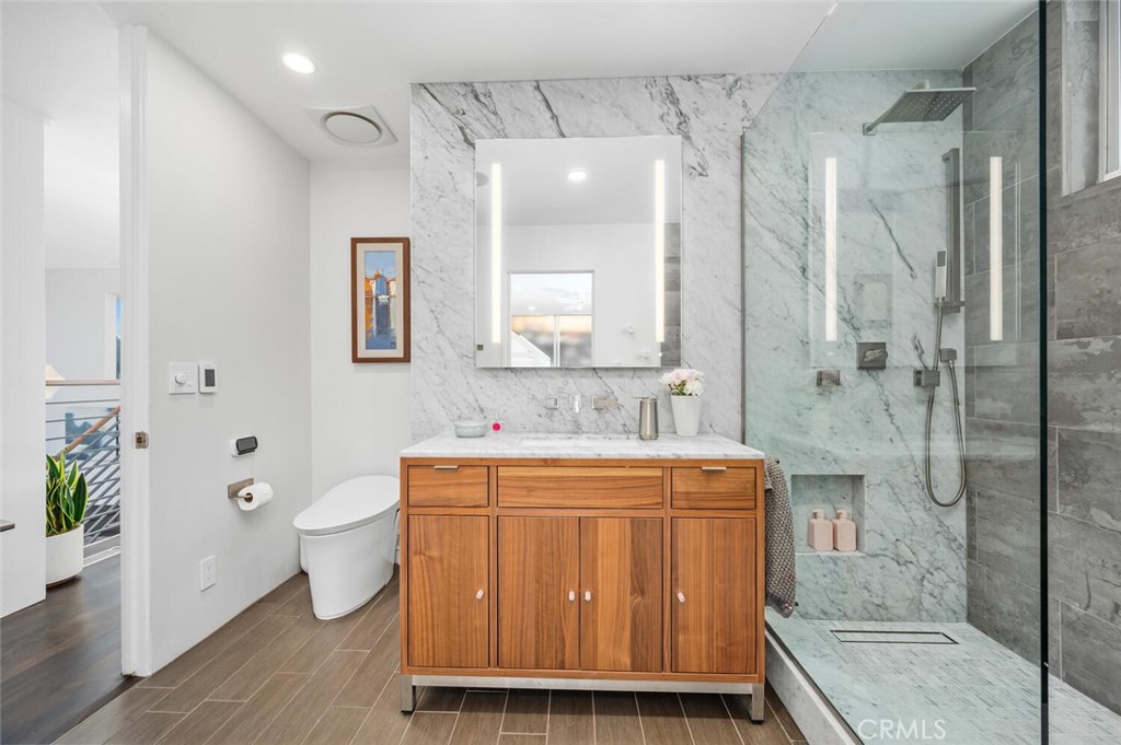 1340 Cerritos Drive Laguna Beach, CA 92651 - Photo 25 of 46 a bathroom with a sink a toilet and shower