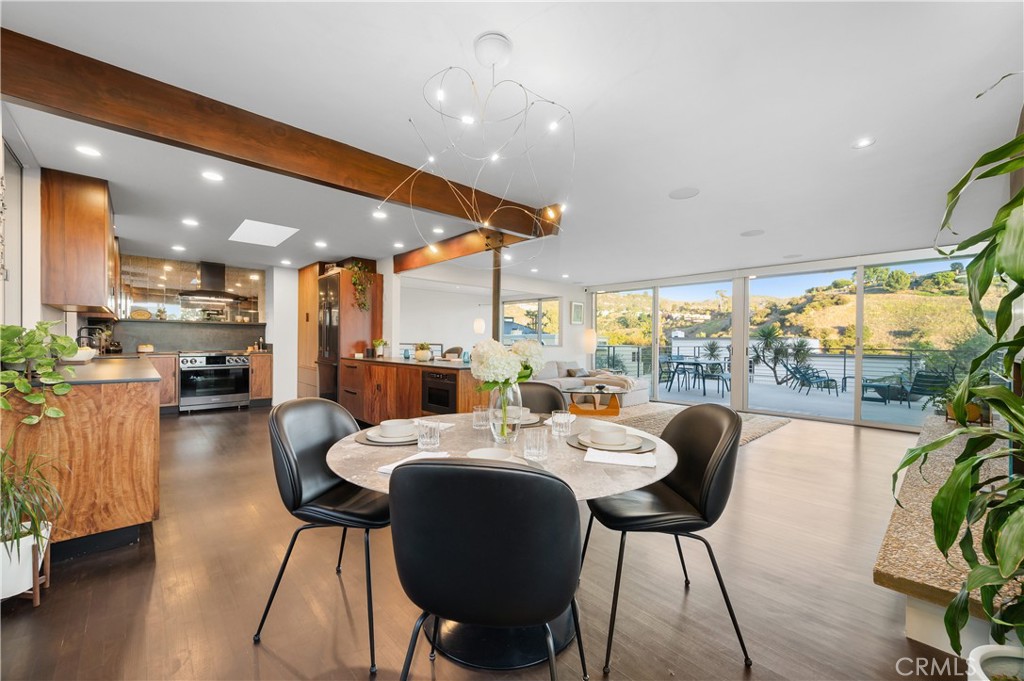 1340 Cerritos Drive Laguna Beach, CA 92651 - Photo 4 of 46 a large kitchen with a table and chairs