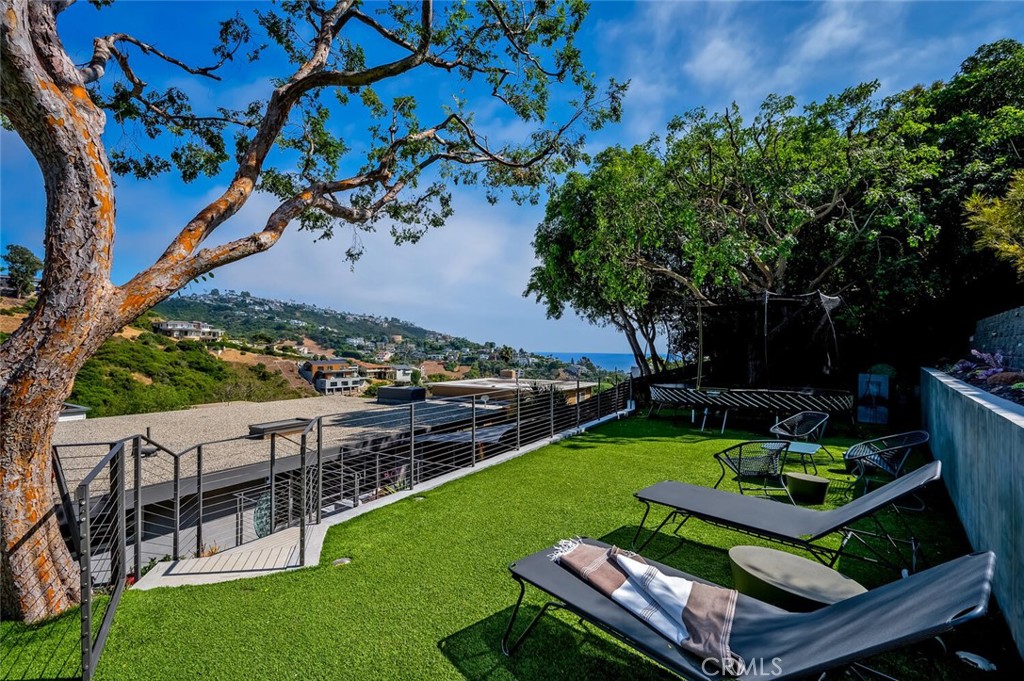 1340 Cerritos Drive Laguna Beach, CA 92651 - Photo 41 of 46 a view of a wooden deck and a yard