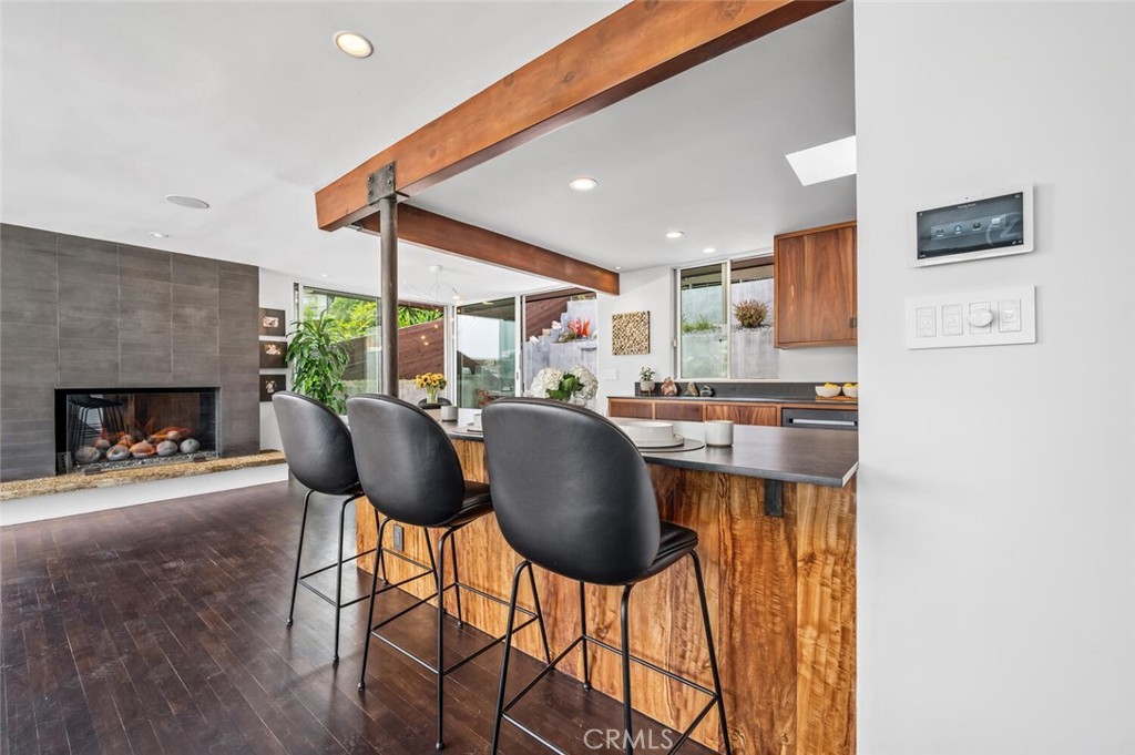 1340 Cerritos Drive Laguna Beach, CA 92651 - Photo 7 of 46 a dining room with furniture and a fireplace