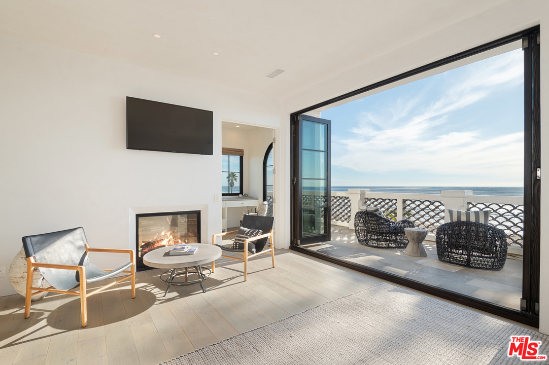 30826 Broad Beach Road Malibu, CA 90265 - Photo 2 of 23 a living room with furniture fireplace and flat screen tv