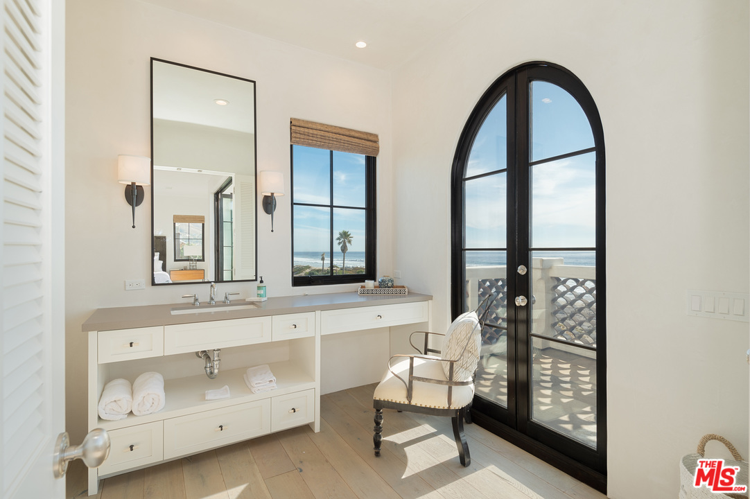 30826 Broad Beach Road Malibu, CA 90265 - Photo 13 of 23 a living room with a bed furniture and a window