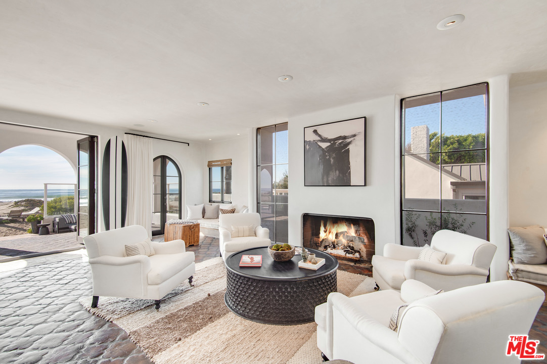 30826 Broad Beach Road Malibu, CA 90265 - Photo 7 of 23 a living room with furniture and a fireplace