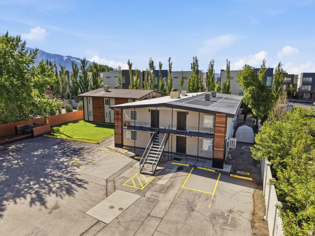 831 Lennox Street, Unit 5 Midvale, UT 84047 - Photo 2 of 19 View of property featuring uncovered parking and a mountain view