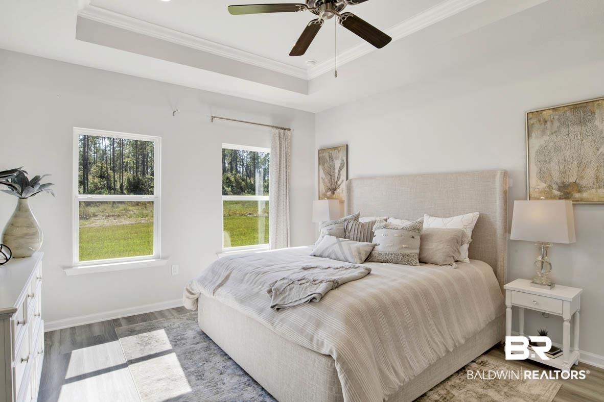 13822 Antler Hl Road Daphne, AL 36527 - Photo 33 of 39 Bedroom with ceiling fan, multiple windows, and wood-type flooring