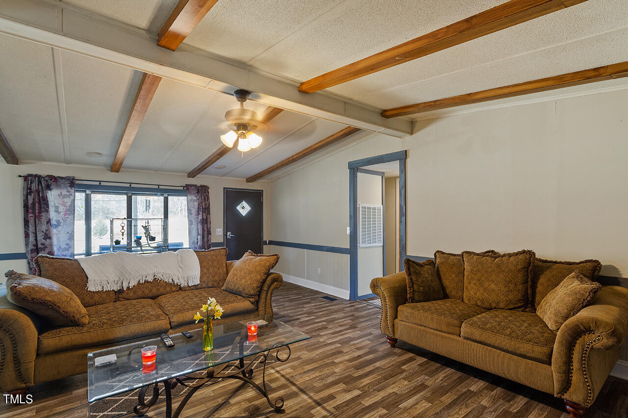4320 Mitchell Mill Road Wake Forest, NC 27587 - Photo 3 of 24 a living room with furniture and a wooden floor