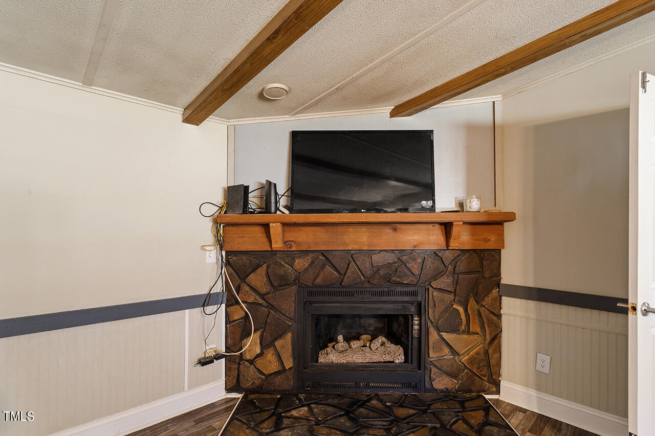 4320 Mitchell Mill Road Wake Forest, NC 27587 - Photo 5 of 24 a room with furniture and a fireplace