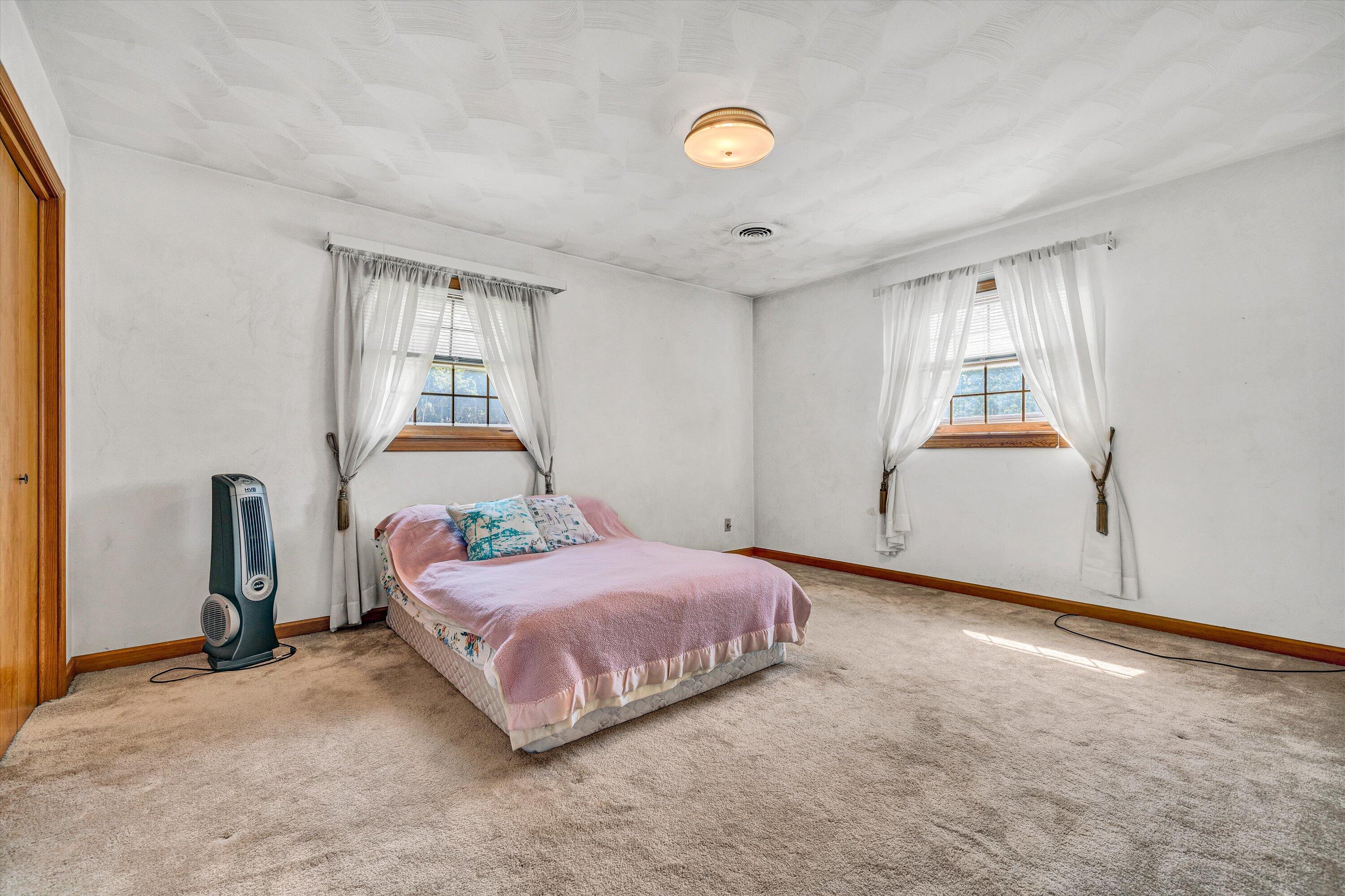233 Morning Dove Lane Blue Ridge, VA 24064 - Photo 23 of 71 a bedroom with a bed and window