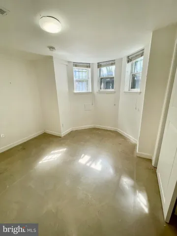 a view of empty room with windows