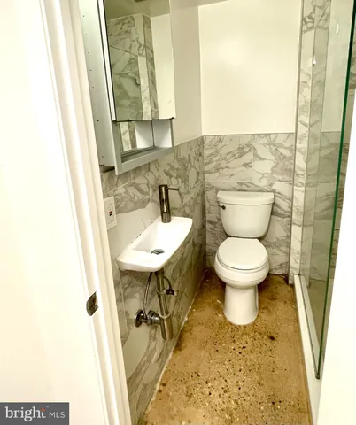 a bathroom with a sink and a toilet