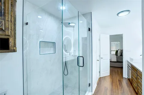 a bathroom with a bathtub and a shower