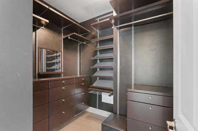 a bathroom with a walk in closet