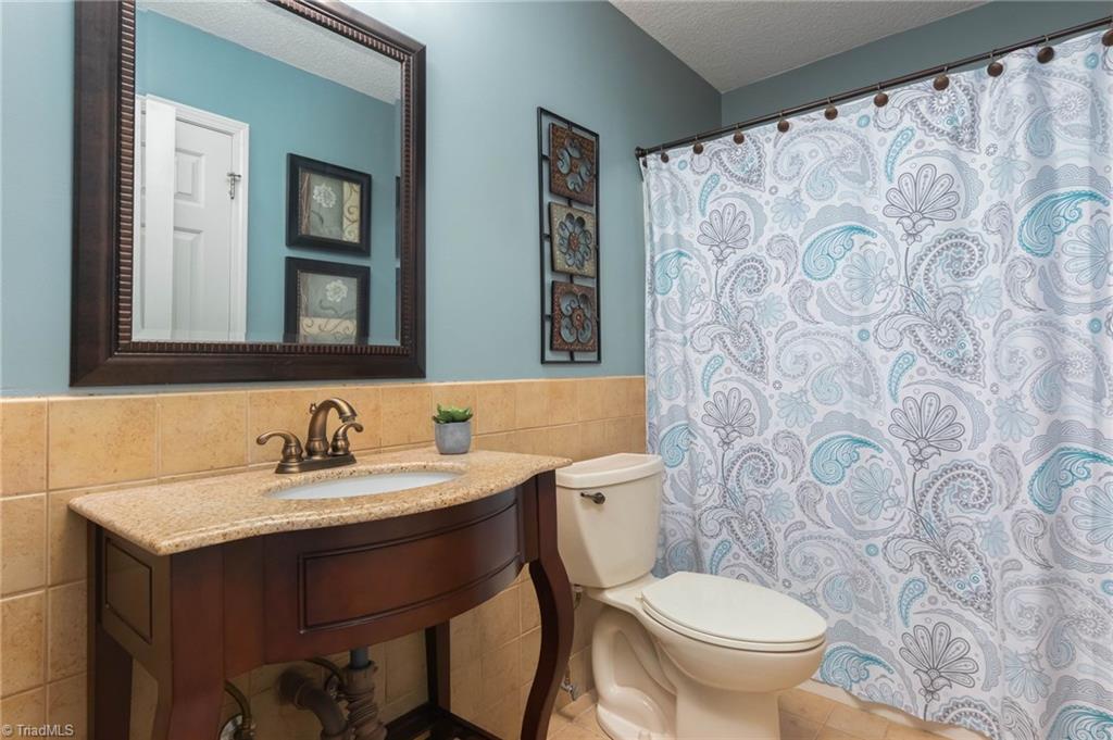 2734 Union Grove Road Lexington, NC 27295 - Photo 22 of 30 Main level hall bath with tile and granite