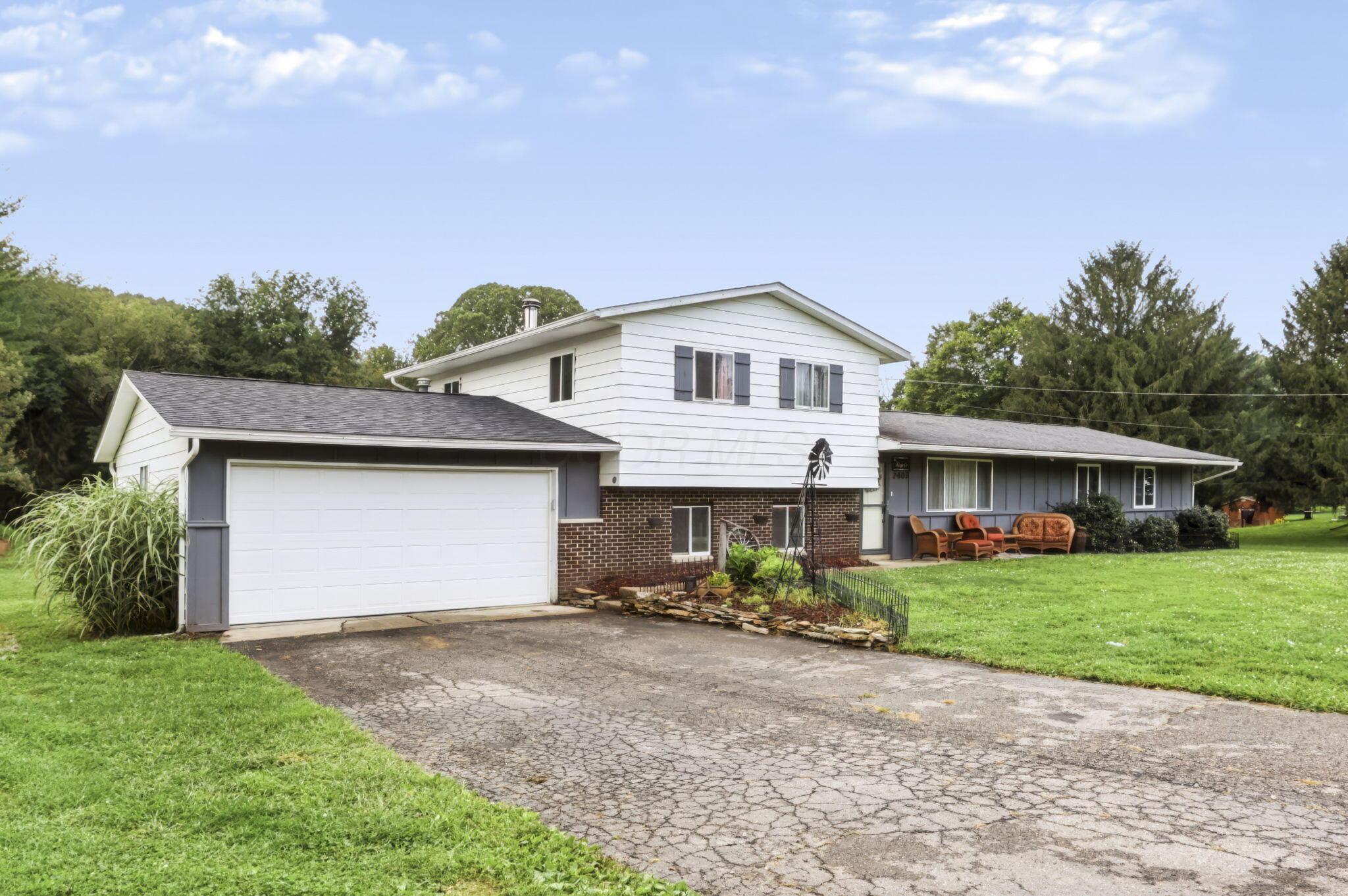 2403 Hickman Road Northeast Newark, OH 43055 - Photo 2 of 62 Front Exterior & Attached Garage