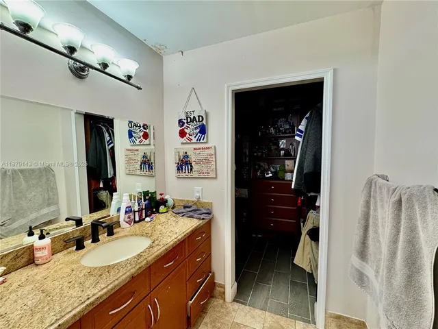 a bathroom with a sink double vanity and a shower