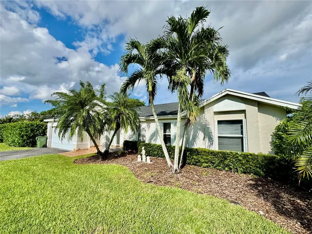 a plant in front of a house