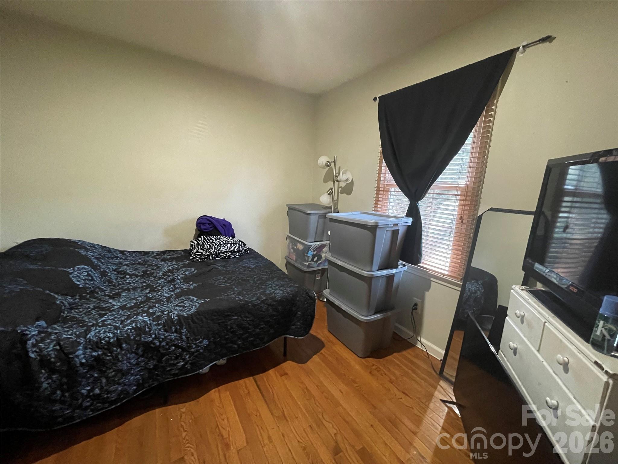 4907 Delmar Griffin Road Monroe, NC 28112 - Photo 13 of 25 a bedroom with a bed and flat screen tv
