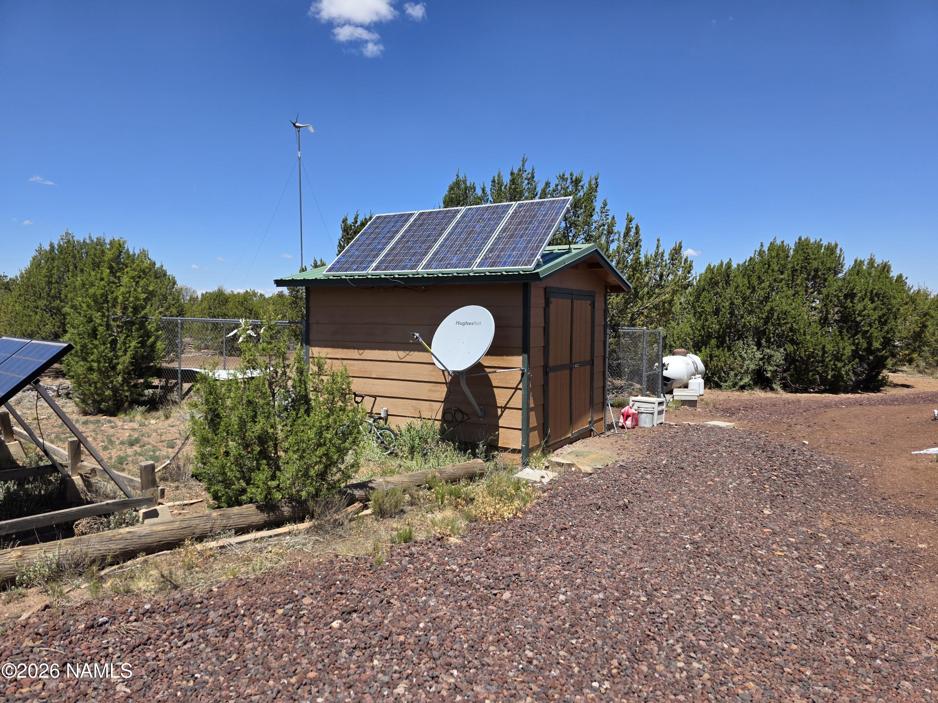 1431 East Cedar Road Williams, AZ 86046 - Photo 41 of 51 a front view of a house with garden